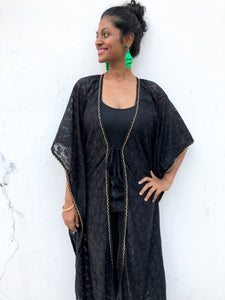 Black lace chiffon long beach kaftan cover up with gold trim around neckline and sleeves Varya black lace chiffon long beach kaftan cover up with gold trim around neckline and sleeves womens beachwear resort wear