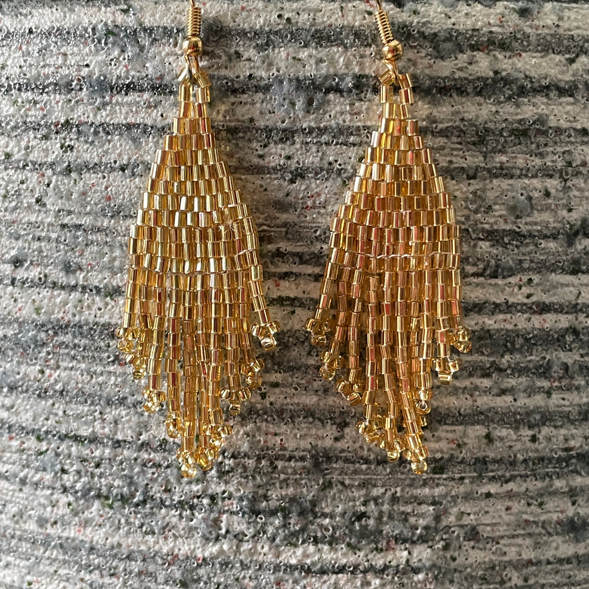 Kaniya shiny gold handmade beaded dangle boho chic earrings slowmade in bali for dubai style