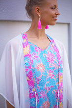 Load image into Gallery viewer, Lestari boho-chic women&#39;s beach kaftan in white with traditional Indonesian pink batik neckline trim, sustainable resort wear from Bali for women in Dubai looking for best beach kaftans and cover ups
