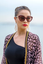 Load image into Gallery viewer, Close-up of gold chain trim on the Sacha leopard print kaftan made from silk chiffon, sustainable resort wear handmade in Bali for women and ladies in Dubai who love unique beachwear
