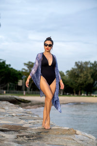 Handcrafted Sahila kaftan with blue snake print & luxurious chiffon, with handsewn neckline beads, handmade in Bali by artisans, for beautiful women in Dubai who love glamorous beach cover ups
