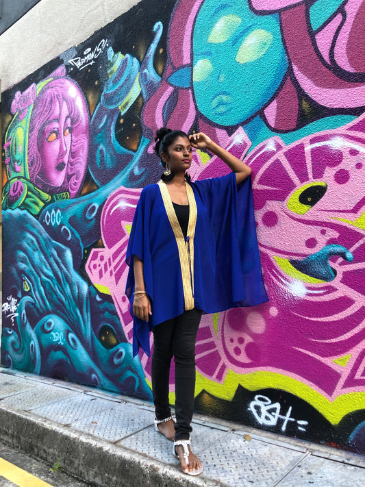 Arista Royal blue beach kaftan cover up with shiny gold saree trim, luxury chiffon swimwear cover up with gold trim, ideal for Dubai beach clubs and resorts.

