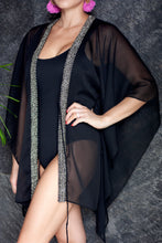 Load image into Gallery viewer, Luxury women’s beach kaftan in black with shimmering metallic neckline detail
