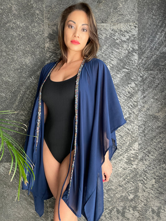 Dubai-style resort wear beach kaftan with handcrafted multi-color bead trim.
