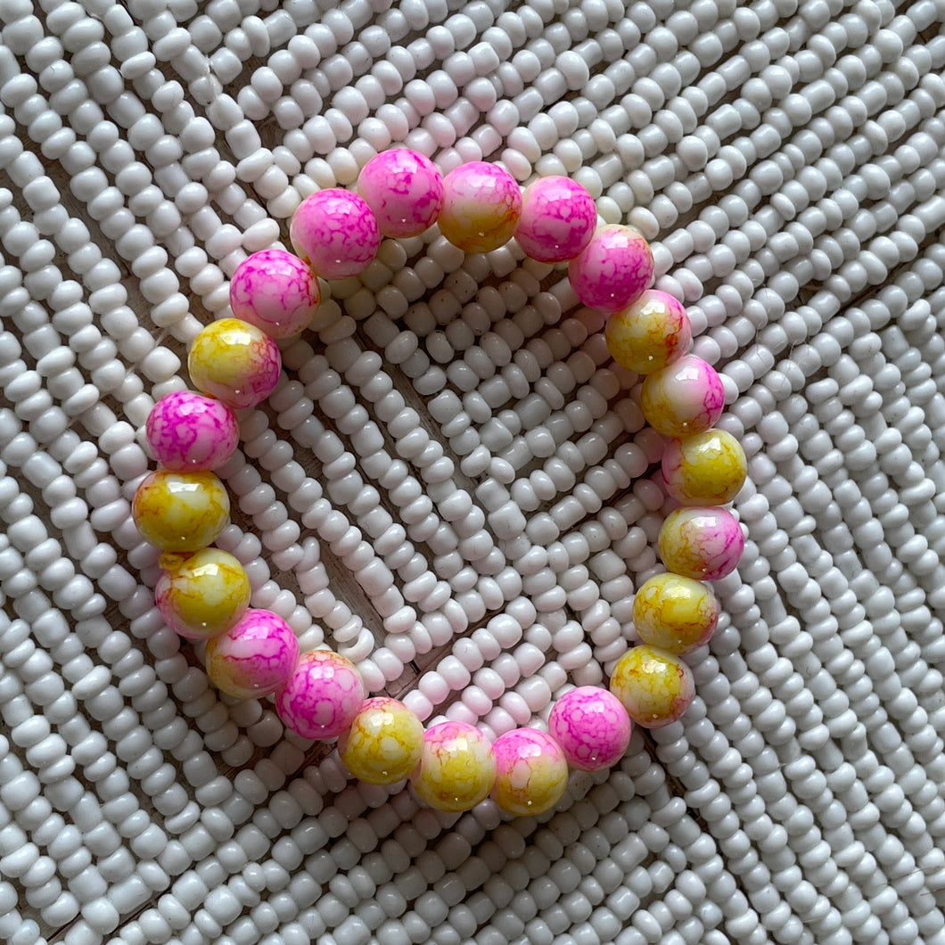 Helmi Kids' Glass Beaded Bracelet in Pink on Yellow