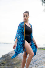 Load image into Gallery viewer, Blue leopard print beach kaftan with gold chain neckline for daring women looking for best beach kaftans in dubai