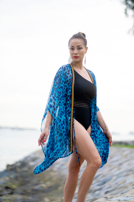 Blue leopard print beach kaftan with gold chain neckline for daring women looking for best beach kaftans in dubai