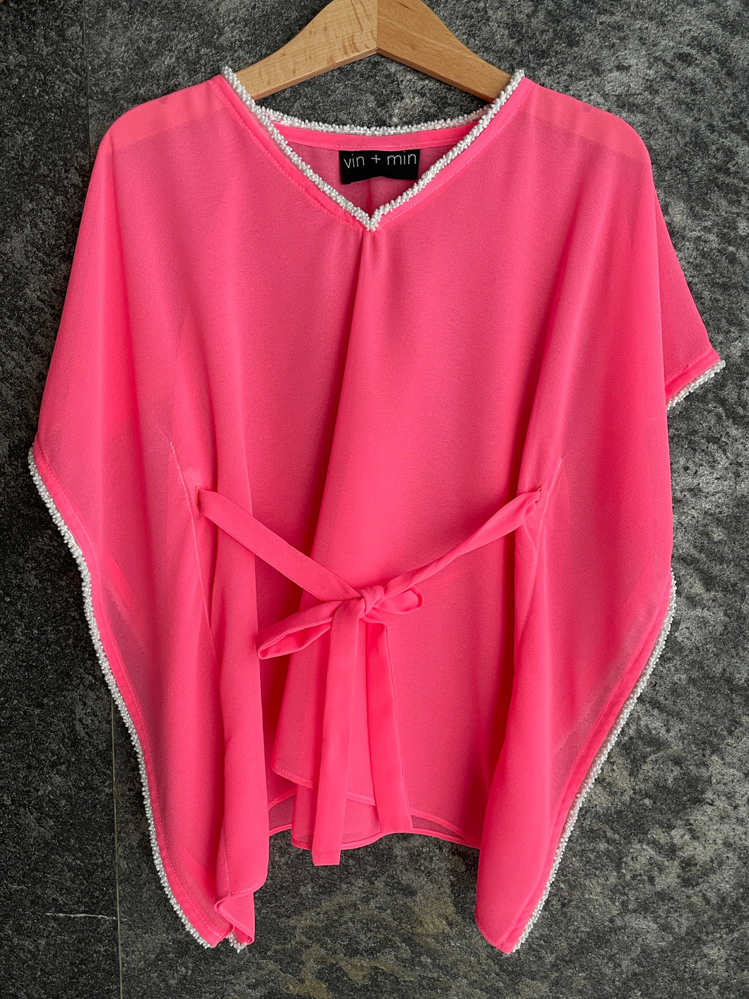 Handmade neon pink kids kaftan with pearl bead neckline, perfect beachwear for girls in Dubai
