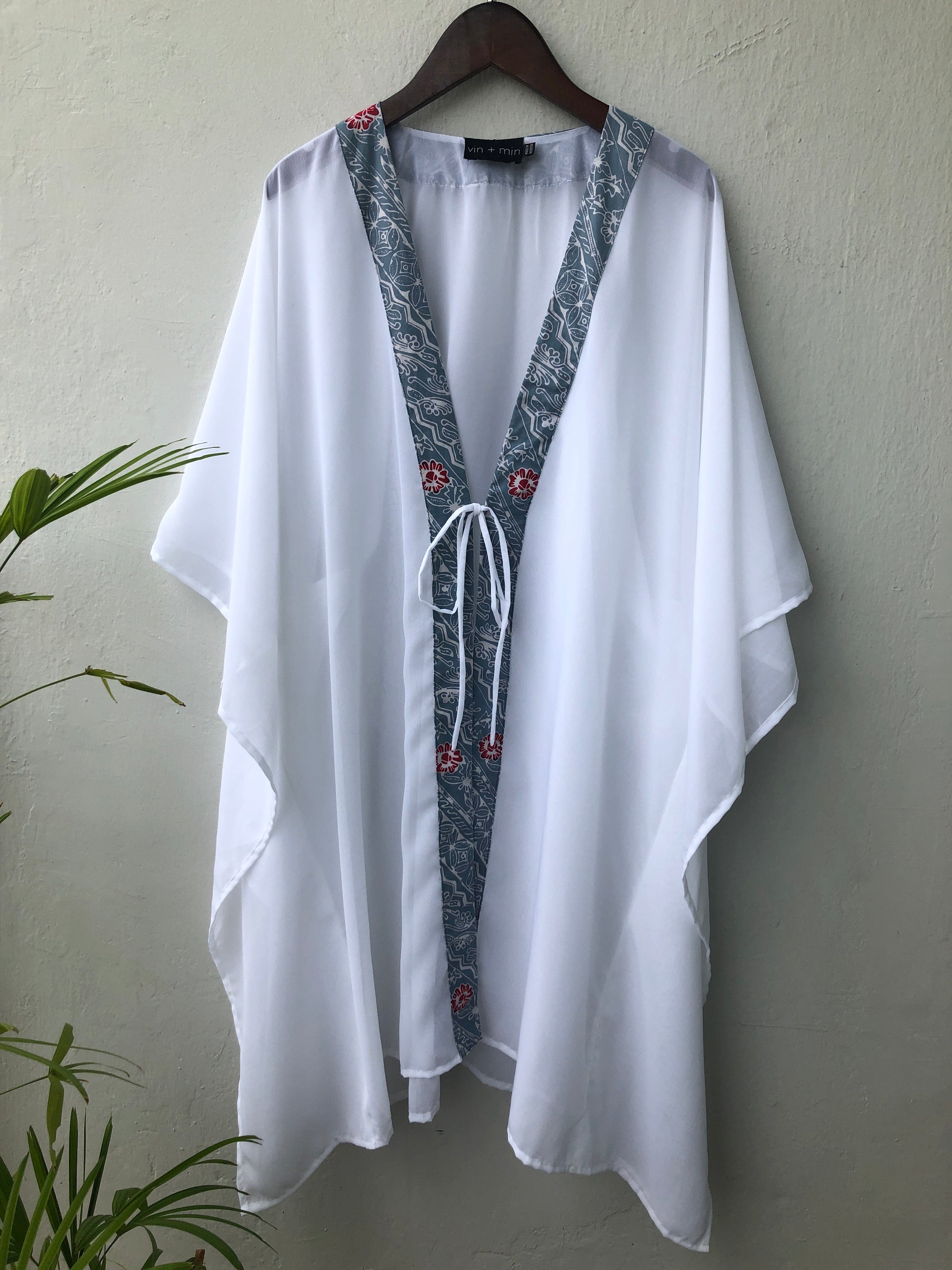 Dubai resort fashion, the Onism lightweight chiffon beach kaftan with artisanal floral batik print from Indonesia, sustainable beachwear for women looking for the best beach kaftans in Dubai