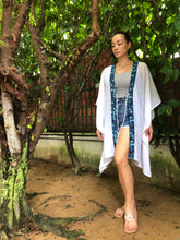Load image into Gallery viewer, Elegant sheer white lurex chiffon kaftan with hand-stamped floral batik trim, lightweight &amp; breezy beach cover-up
