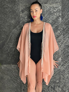 Flowy crepe chiffon beach cover-up in light orange with beaded neckline
