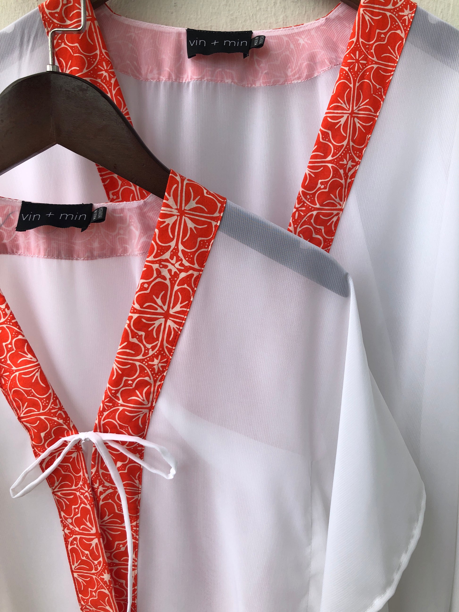 Onism orange floral batik kaftan, a handmade kids cover-up for beach fun also available in a matching mommy version, for sale in Dubai