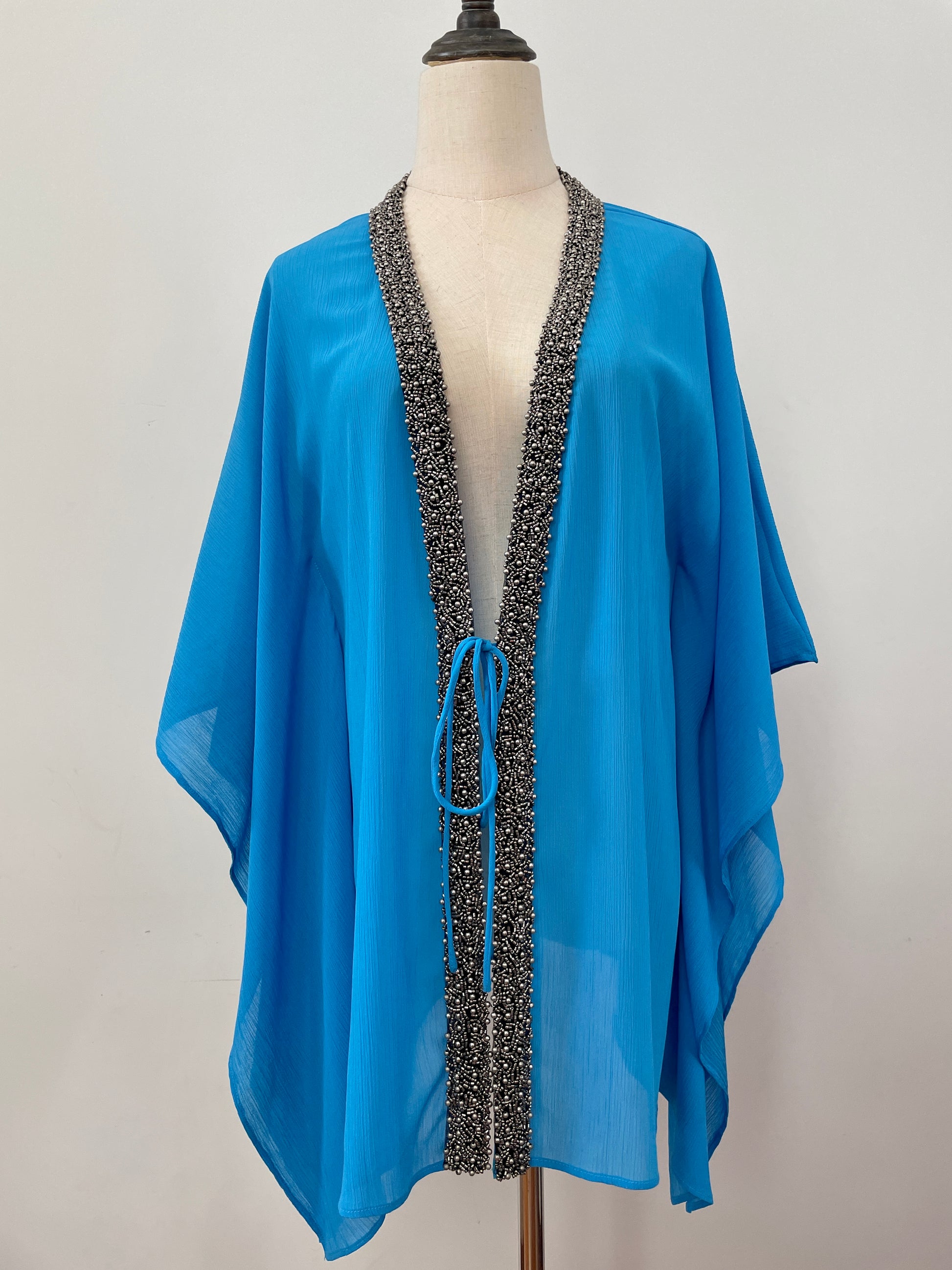Hand-sewn beaded beach cover-up in blue – perfect for poolside glam in Dubai and beyond
