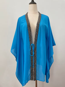 Hand-sewn beaded beach cover-up in blue – perfect for poolside glam in Dubai and beyond
