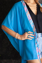 Load image into Gallery viewer, Utama women&#39;s beach kaftan in ocean blue chiffon with handcrafted batik trim – artisanal and stylish for women in Dubai
