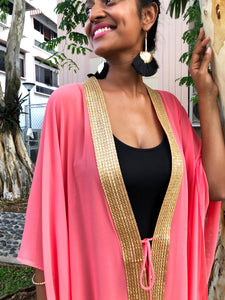 Elegant salmon pink Valeria kaftan for women, featuring luxurious chiffon fabric and gold accents, ideal for beach days in Dubai
