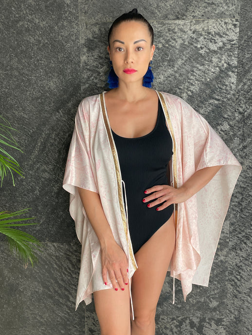 Light pink paisley print Zahra women's beach kaftan with gold-accented neckline trim, perfect resort wear for Dubai.